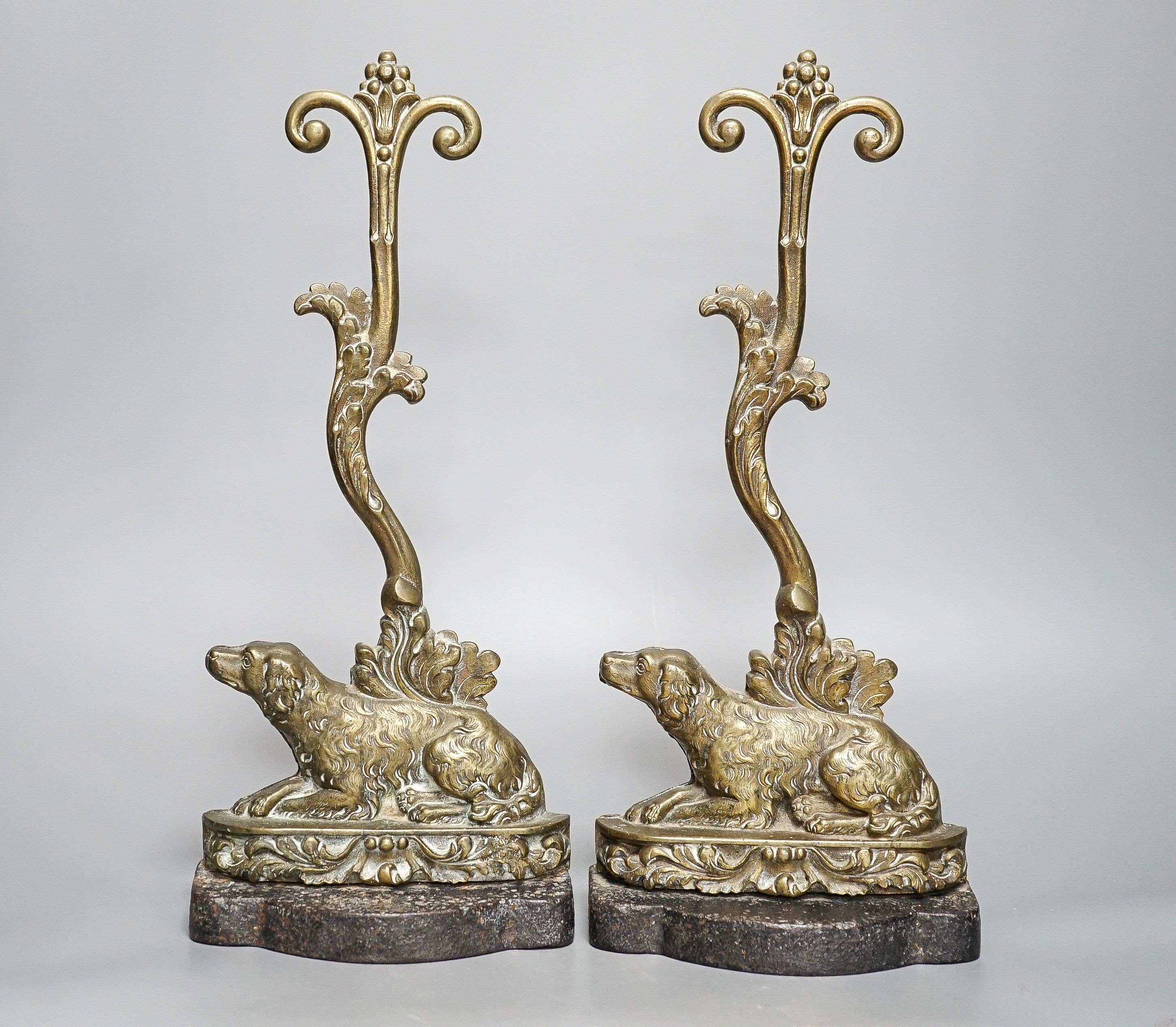Two matching Victorian cast brass ‘spaniel’ door stops.